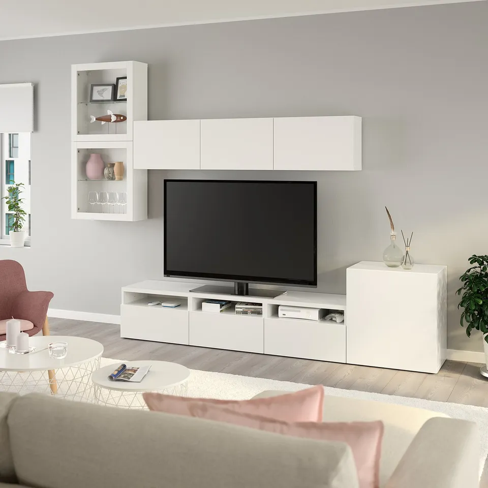 Modern living room with BESTÅ tv unit, sofa, coffee table, and minimalist decor.