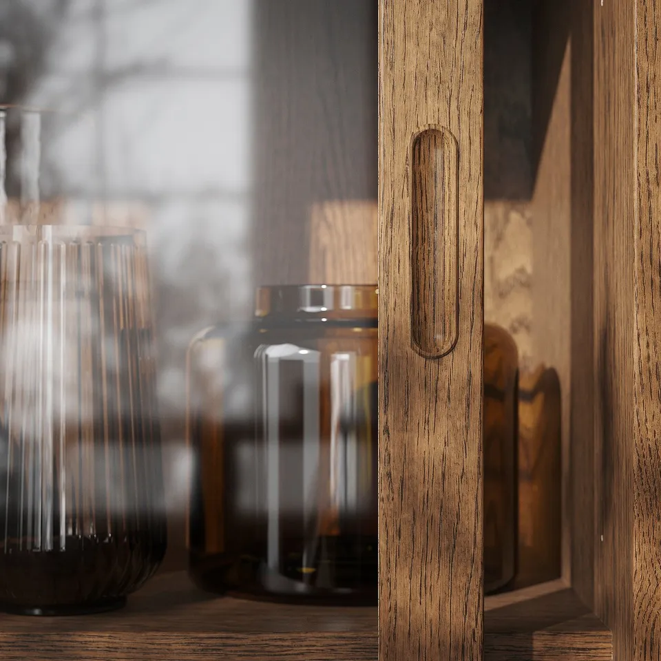 Wooden cabinet with sliding doors and glass vases.