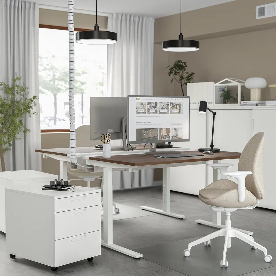 MITTZON white desk & chair setup. Modern design with walnut top. Large, spacious, with height adjustment. Clean, contemporary office setting.