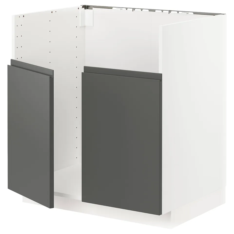 A METOD kitchen unit with dark grey voxtorp fronts. It has a modern, sleek design with integrated handles and a sturdy frame construction.