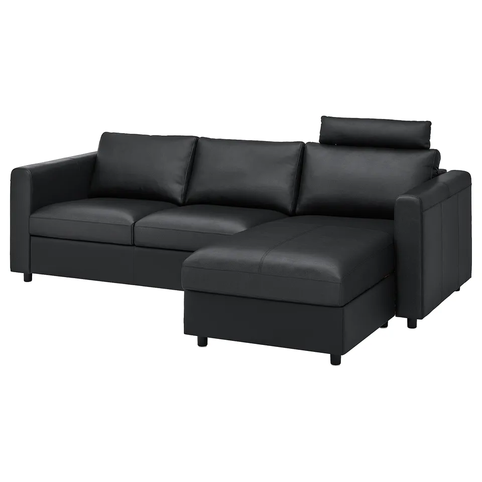 Modern black l-shaped sofa with storage and headrest.