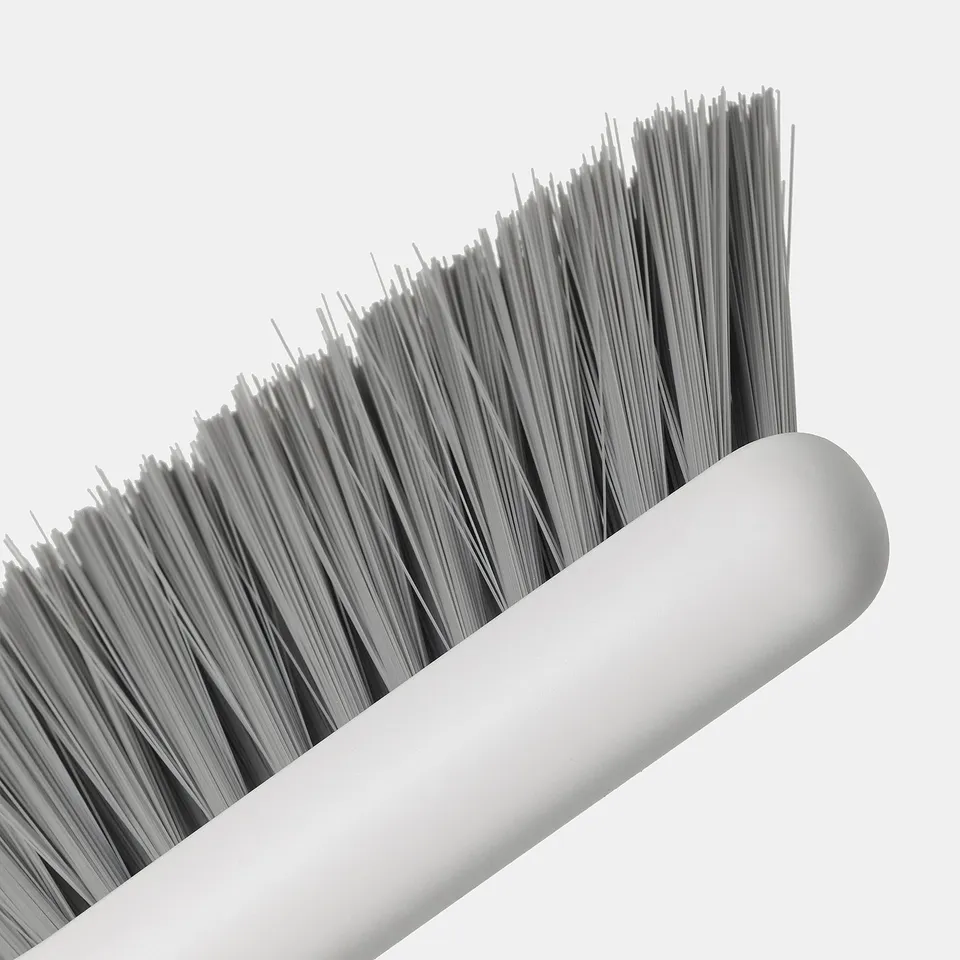 Close-up of PEPPRIG brush bristles and handle, stiff plastic bristles on cylindrical polypropylene handle.