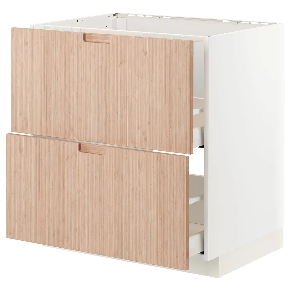 Modern kitchen cabinet with bamboo finish. Two drawers, light colour, rectangular shape, smooth handles.