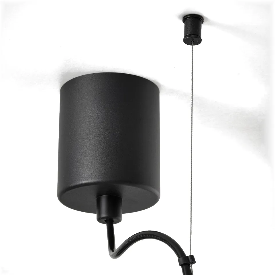 Black pendant lamp with cylindrical shade suspended from ceiling, adjustable height.