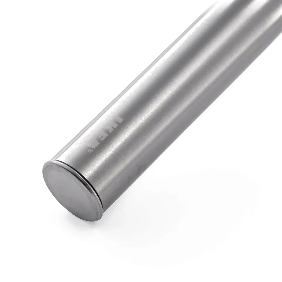 A close-up of a polished, metallic whisk with a smooth handle and end cap, showcasing its high-quality finish.