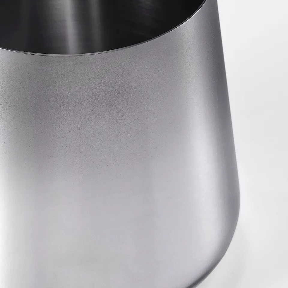 Sleek silver metal jar with smooth surface and secure lid, showcasing modern design and durability.