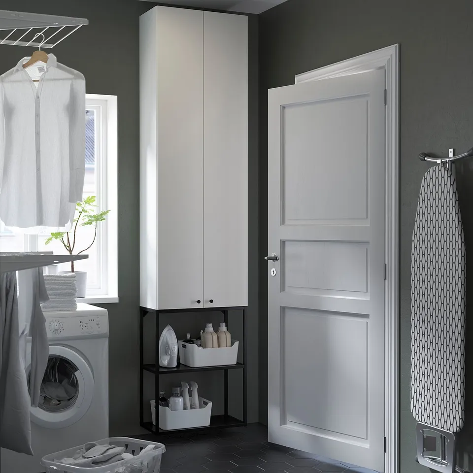 Modern laundry room with ENHET storage, open shelf, and washing machine.