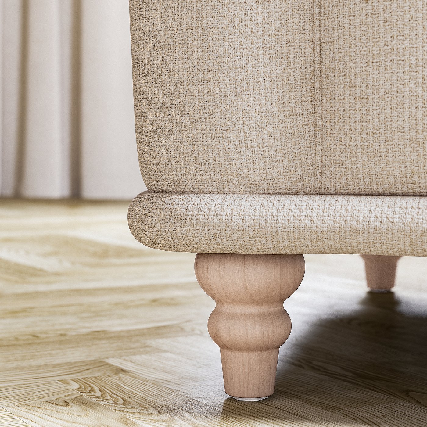 A beige VISKAFORS armchairs leg, featuring classic design with turned wood detail.