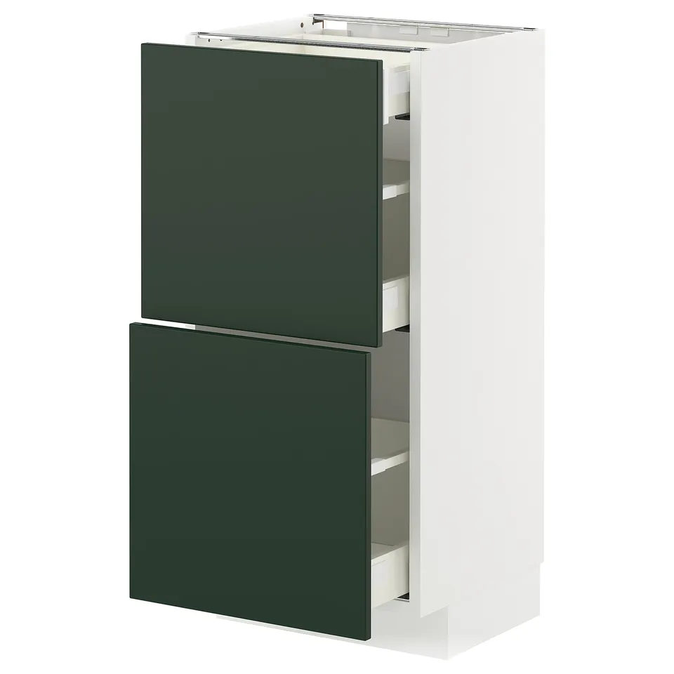 A METOD kitchen cabinet with green havstorp fronts, white frame, and pull-out drawers.