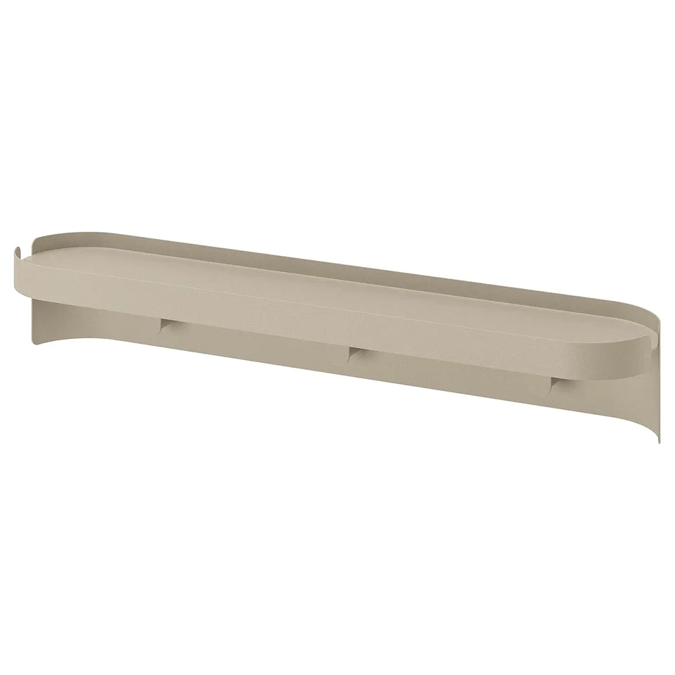Is of a FLORSJÖN shelf in beige. It is slim and rectangular with a curved edge, made of acrylic-coated steel.