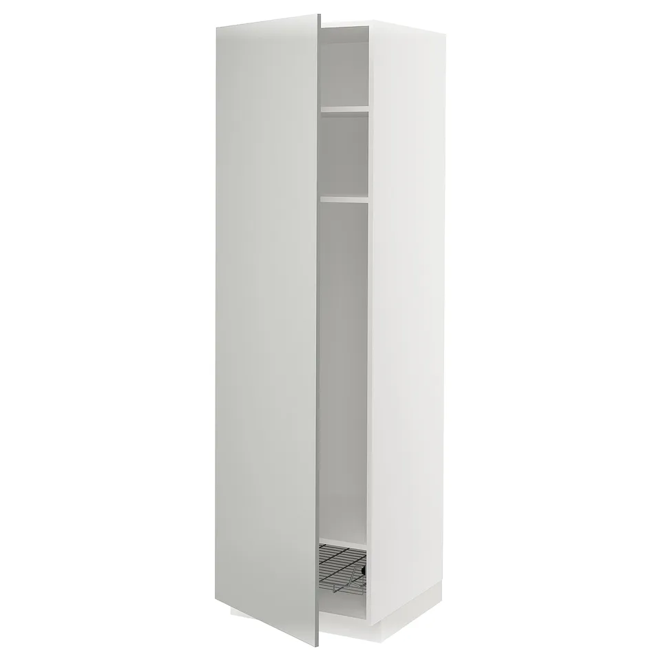 A white METOD kitchen cabinet with one door open, revealing a wire basket and shelves.