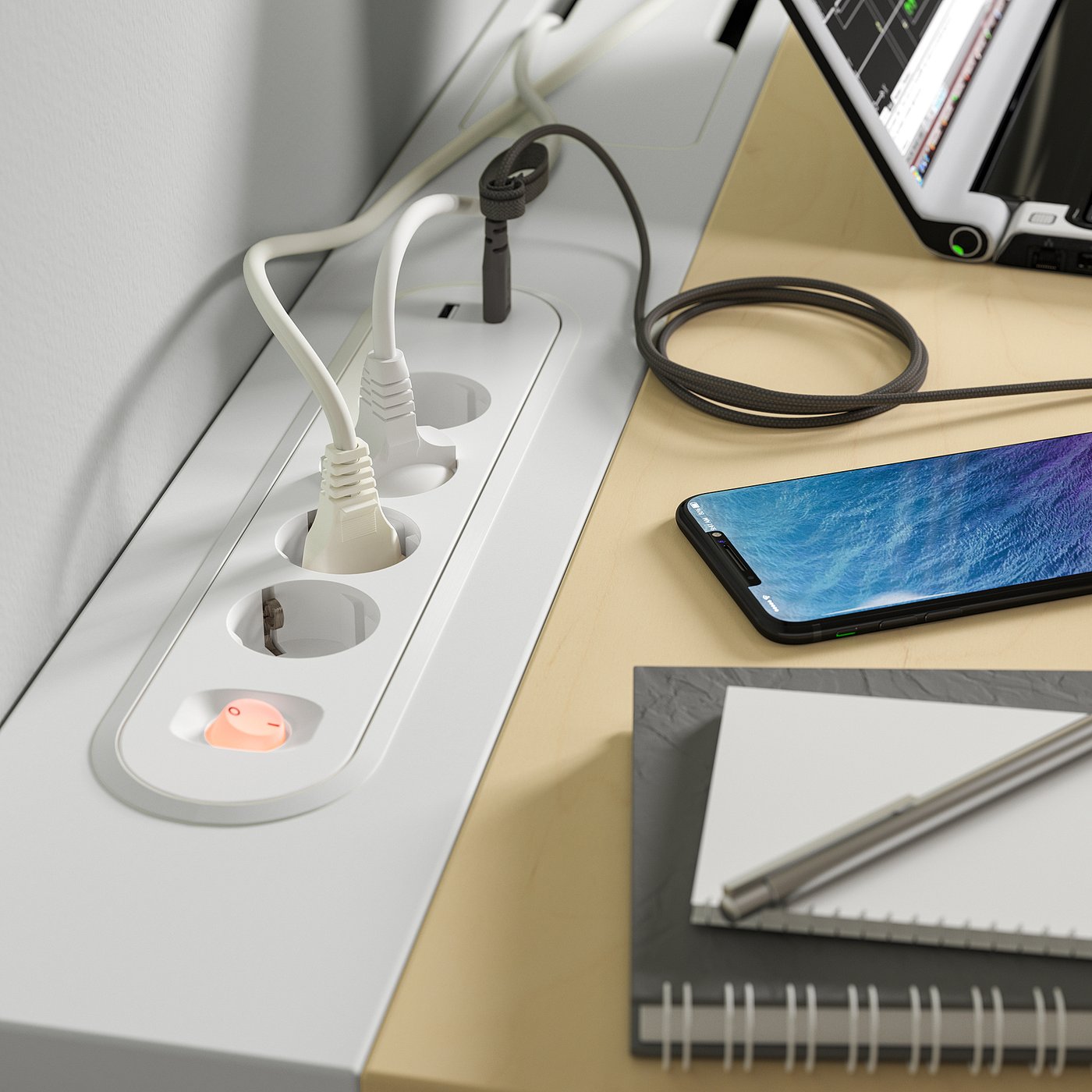 Desk with cable management tray and multiple power sockets.