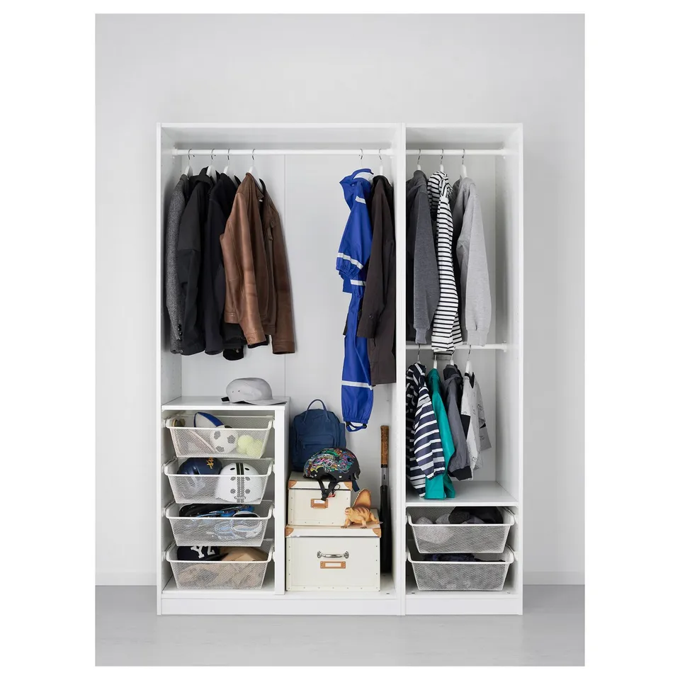 White PAX wardrobe with organised clothes and accessories.