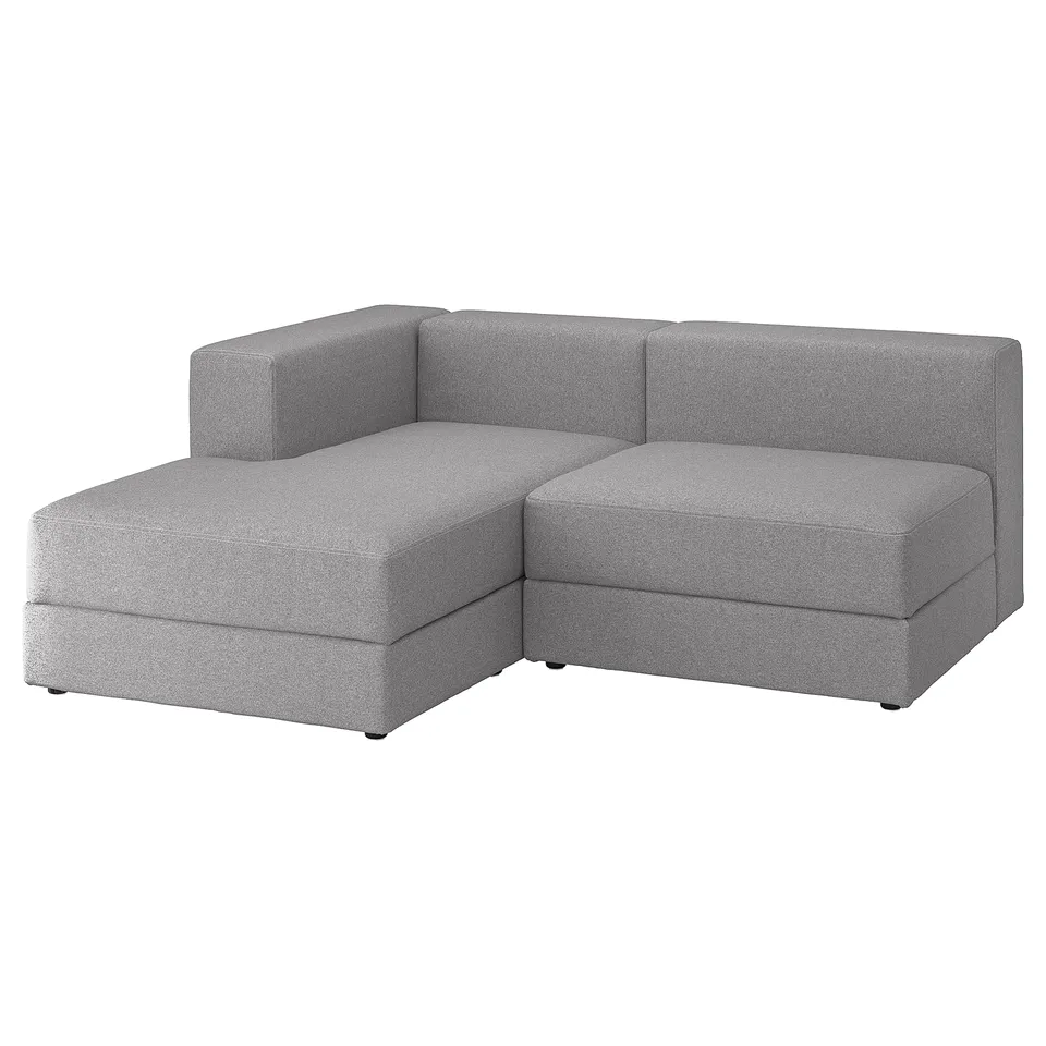 Modern grey modular sofa with chaise, clean lines, soft cushions, under-seat storage.
