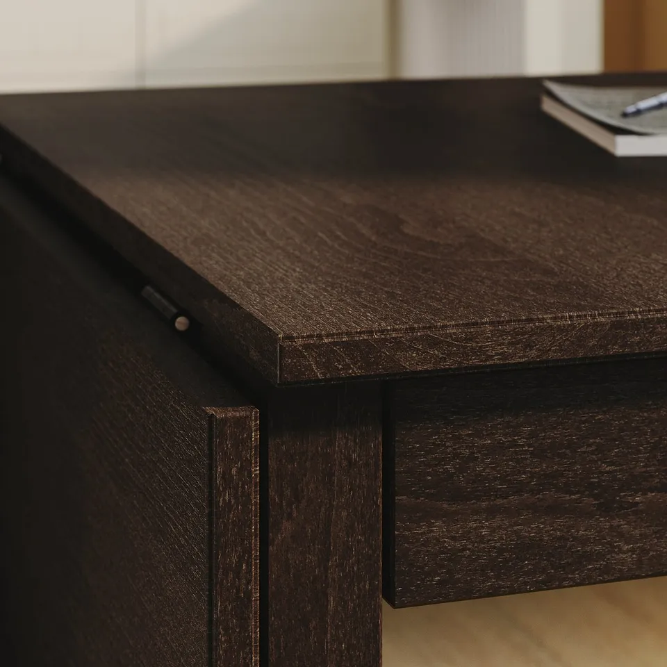 Dark wooden desk with smooth, polished surface and visible grain texture.