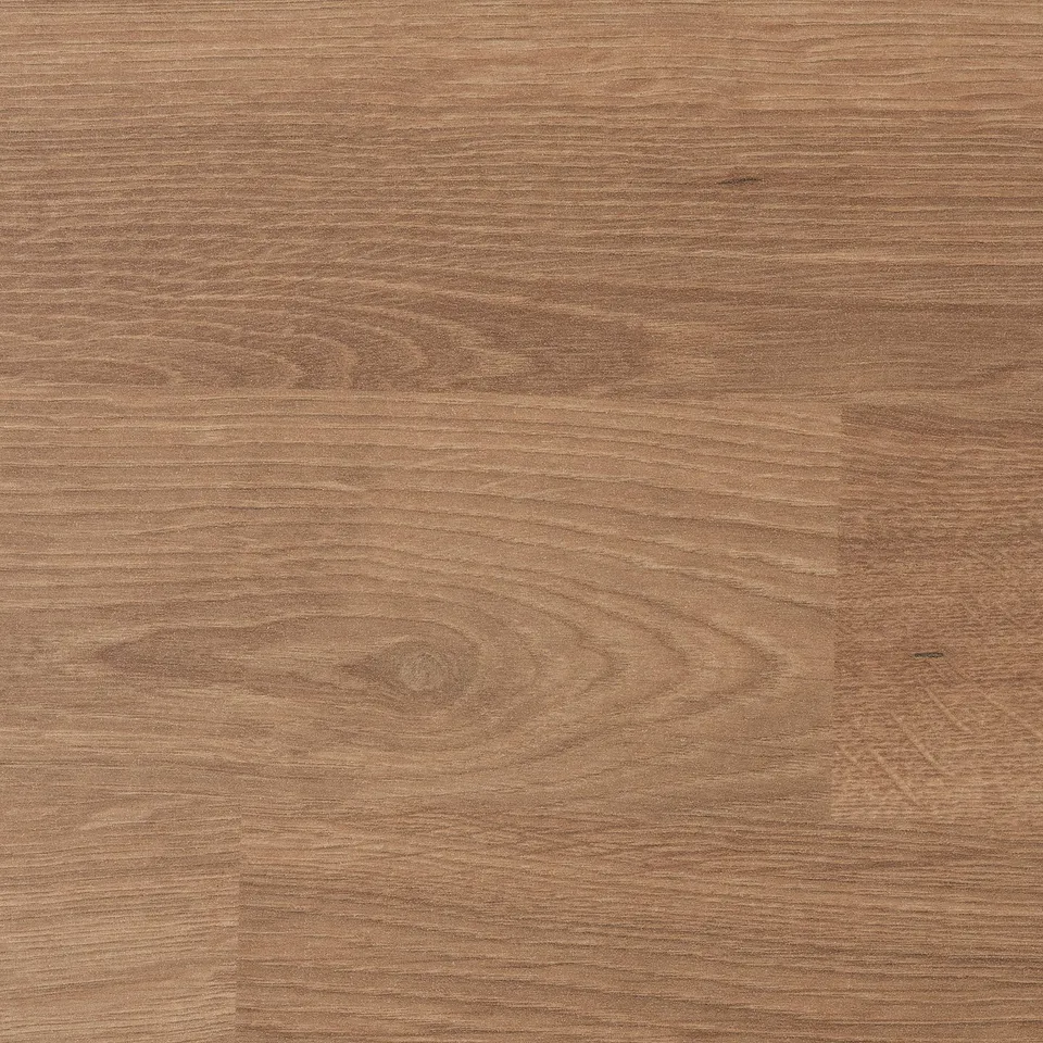 A close-up of a smooth, light brown laminate surface, highlighting its quality and texture.