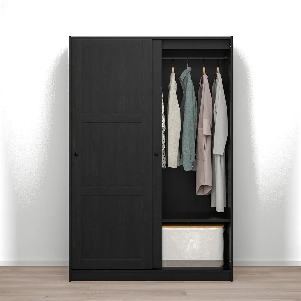 Black wardrobe with sliding doors and hangers, showcasing its storage and organisation functionality.