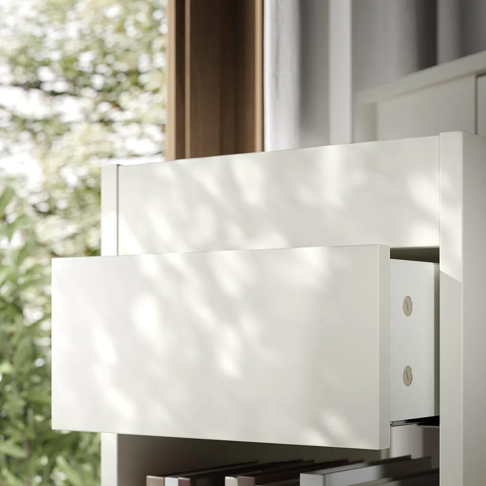 Modern white drawer unit with sleek design. Soft-closing drawers and castors for easy movement.