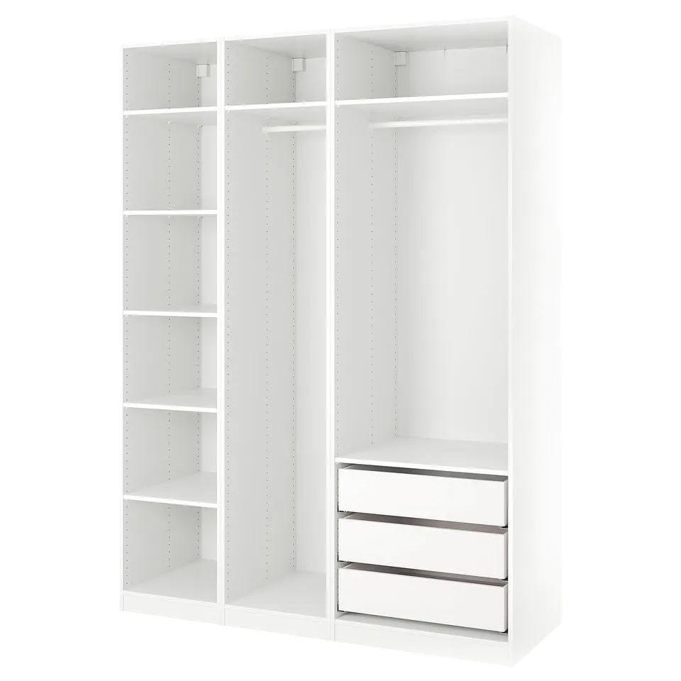 An ikea PAX wardrobe in white with a modular design featuring shelves and drawers.