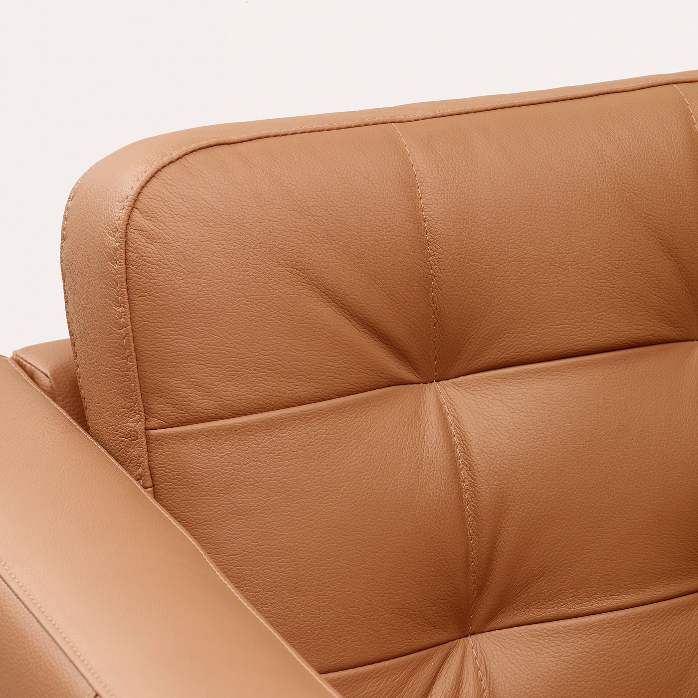 Brown leather chair, detailed stitching, soft texture, quality upholstery, comfortable design.