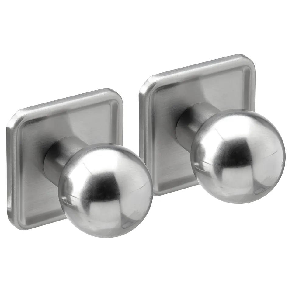 Two round stainless steel knobs on square plates, modern retro design.