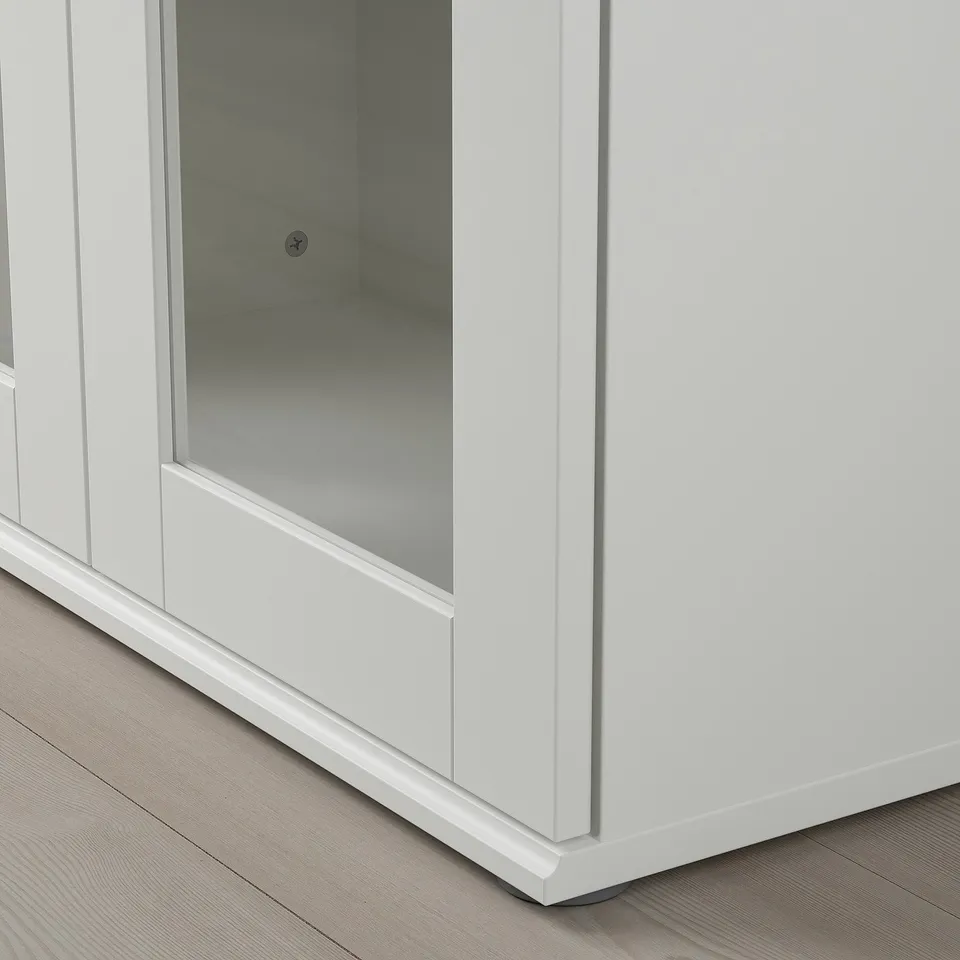 Modern white cabinet with glass doors, sleek design, clean lines, and sturdy build.