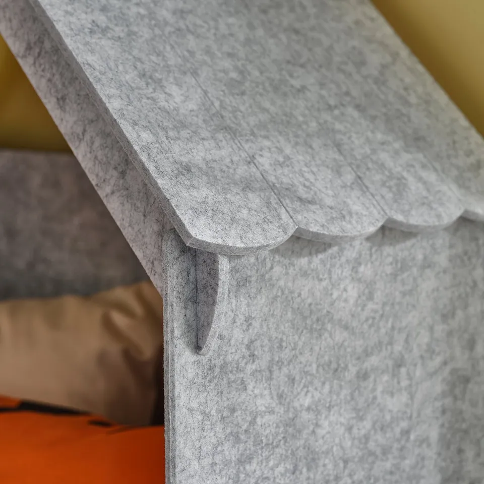Close-up of SLÄKT bed frame corner, showing smooth, rounded edges and sturdy design.