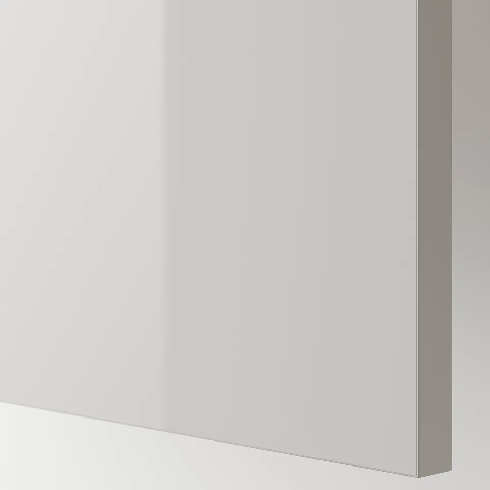High-gloss white cabinet panel; modern, sleek design; durable and easy to clean.