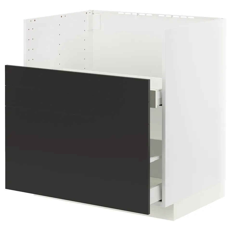 A METOD black kitchen cabinet with a white frame. It modern, smooth-running drawers and a sleek, minimalist design.