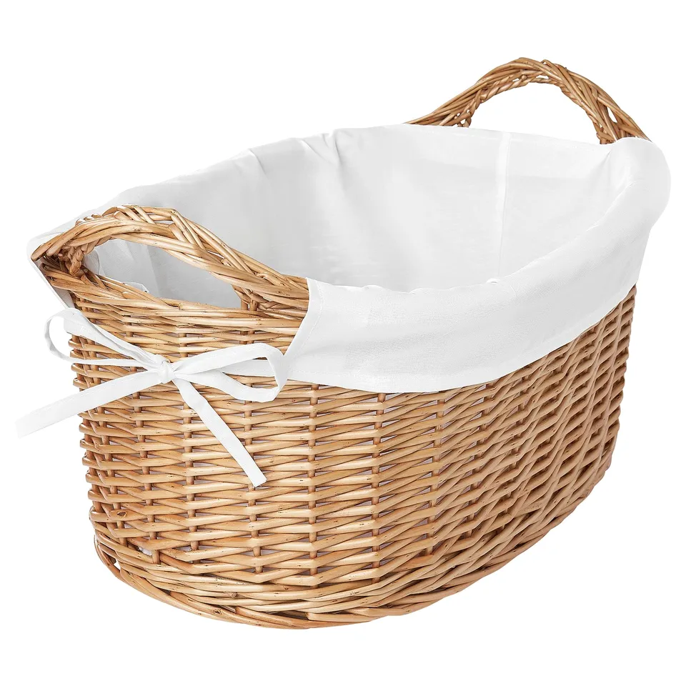 Natural willow laundry basket with white bag.