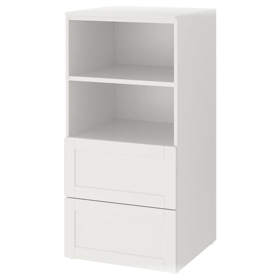 Small white ikea bookcase with three shelves and two drawers, simple modern design.