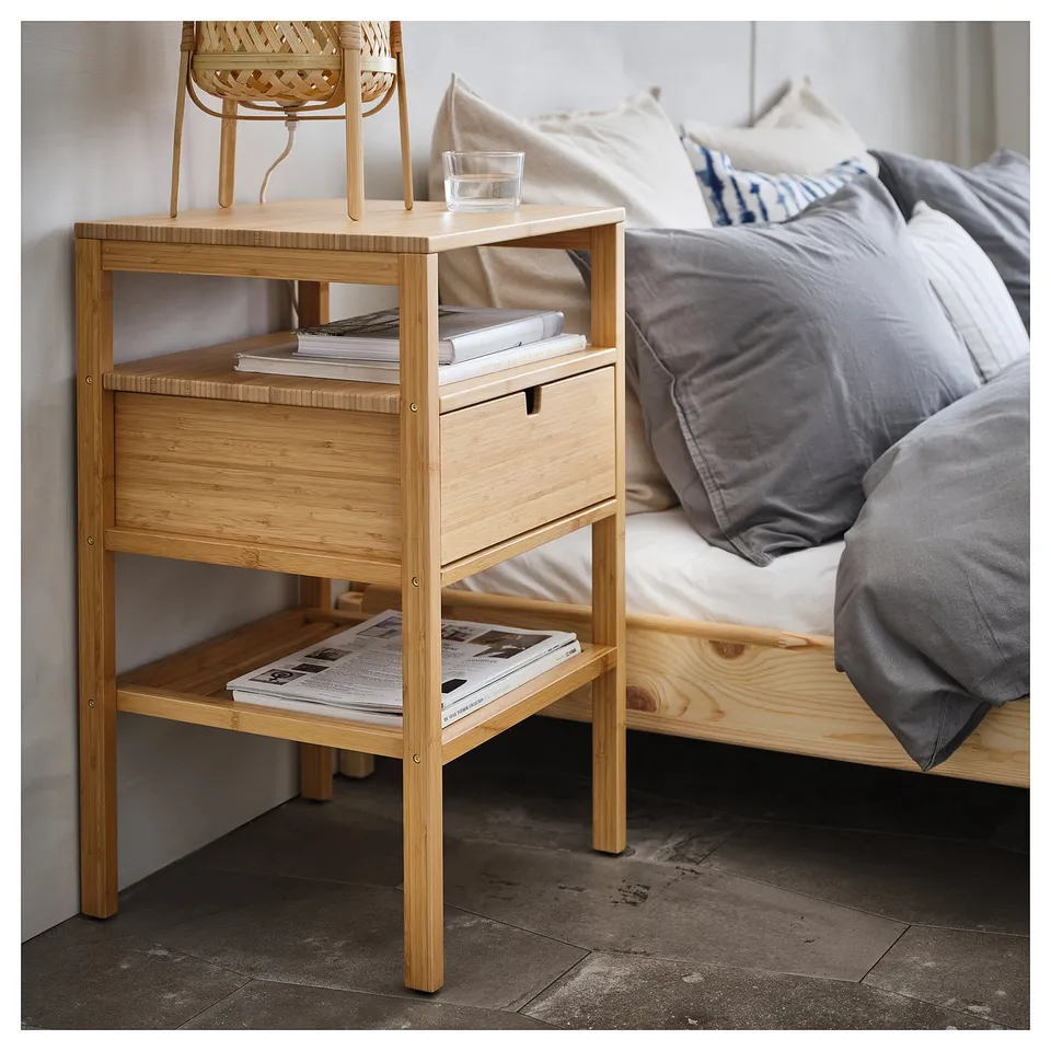 Bedside table NORDKISA in wood; light brown, rectangular, with drawer and open shelves.