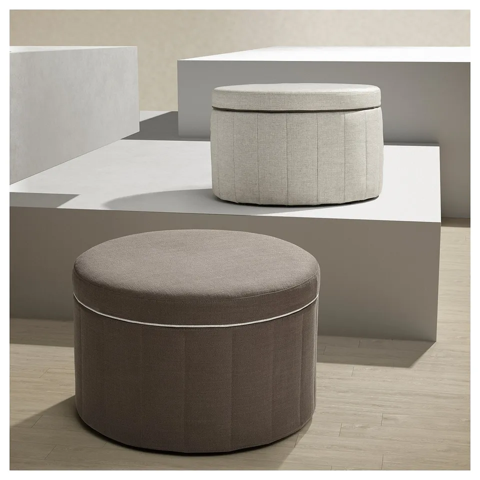 Two stylish, round storage ottomans: one beige, one brown; sleek, upholstered design.