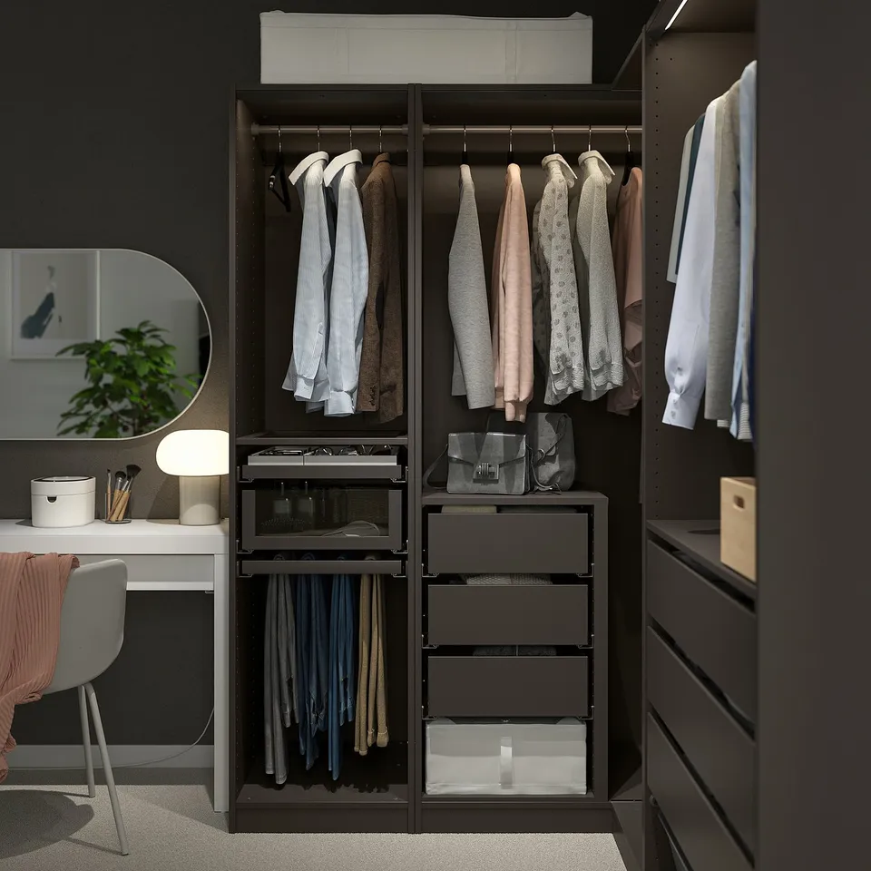 Dark PAX wardrobe organising clothes & accessories with hanging areas, shelves, & drawers.