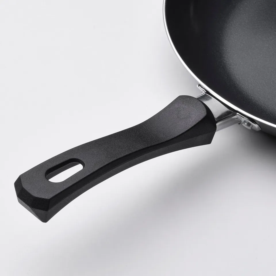 Close-up of lightweight, non-stick frying pans handle. Smooth grip for easy handling.
