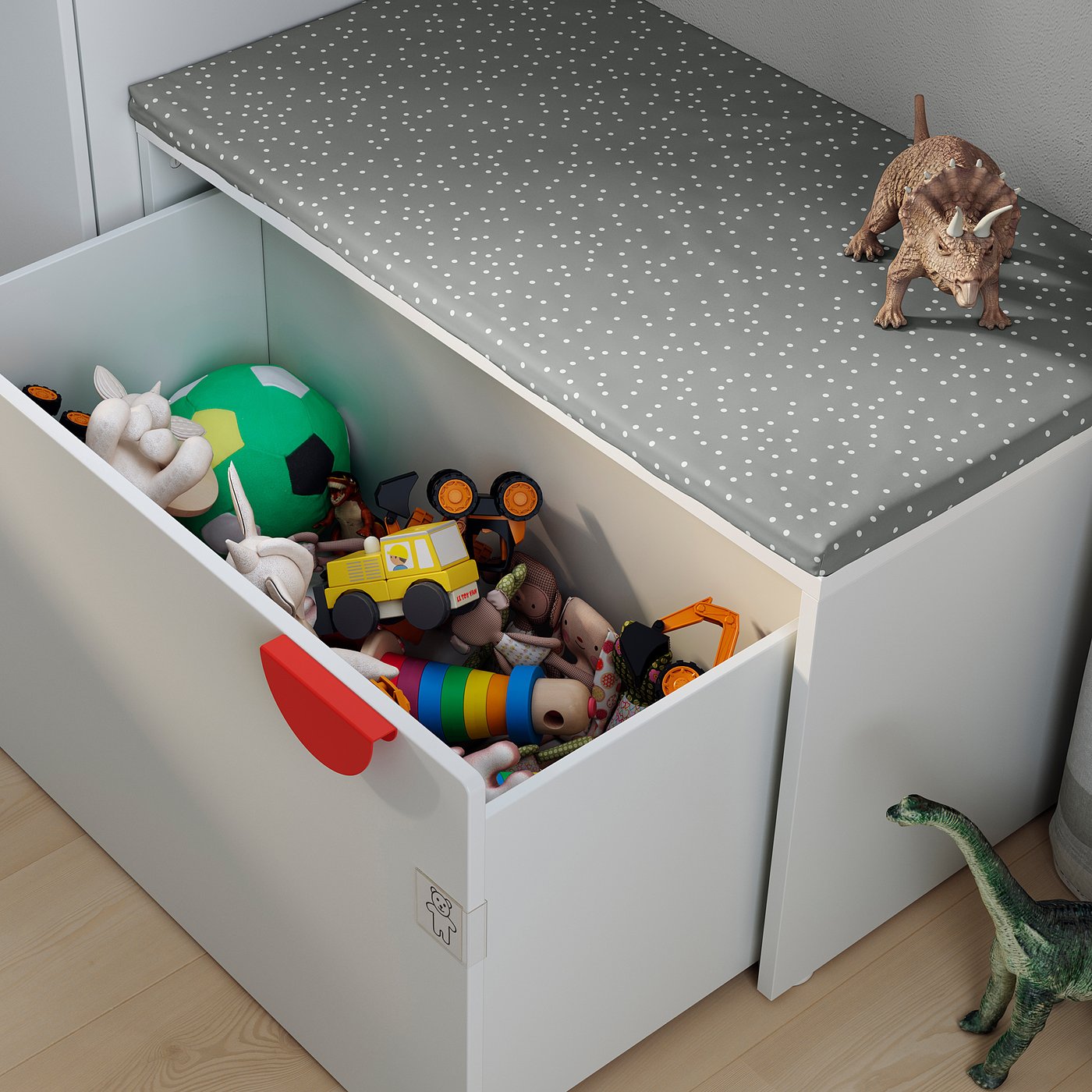 Childs toy box with toys and dinosaurs. White, square, open top.