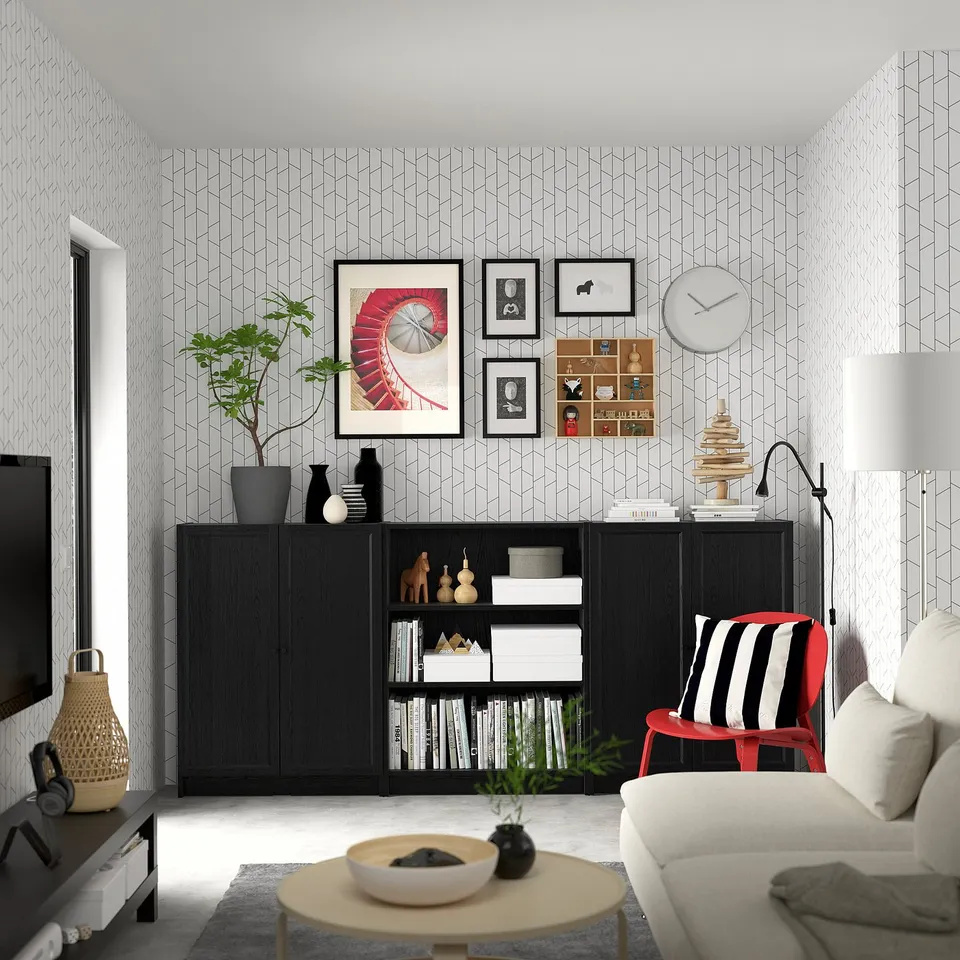 Living room with BILLY black sideboard, tv, couch, coffee table, and lamp.