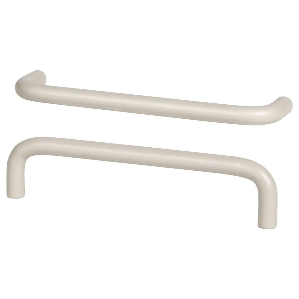 BAGGANÄS beige cabinet handles, rounded shape, modern design, smooth finish.