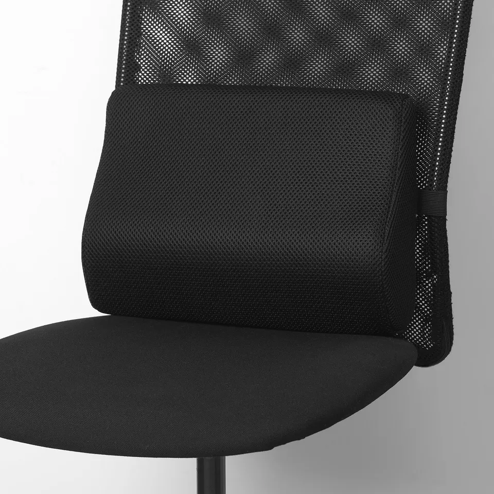 Black office chair with mesh back and lumbar support cushion attached to it.