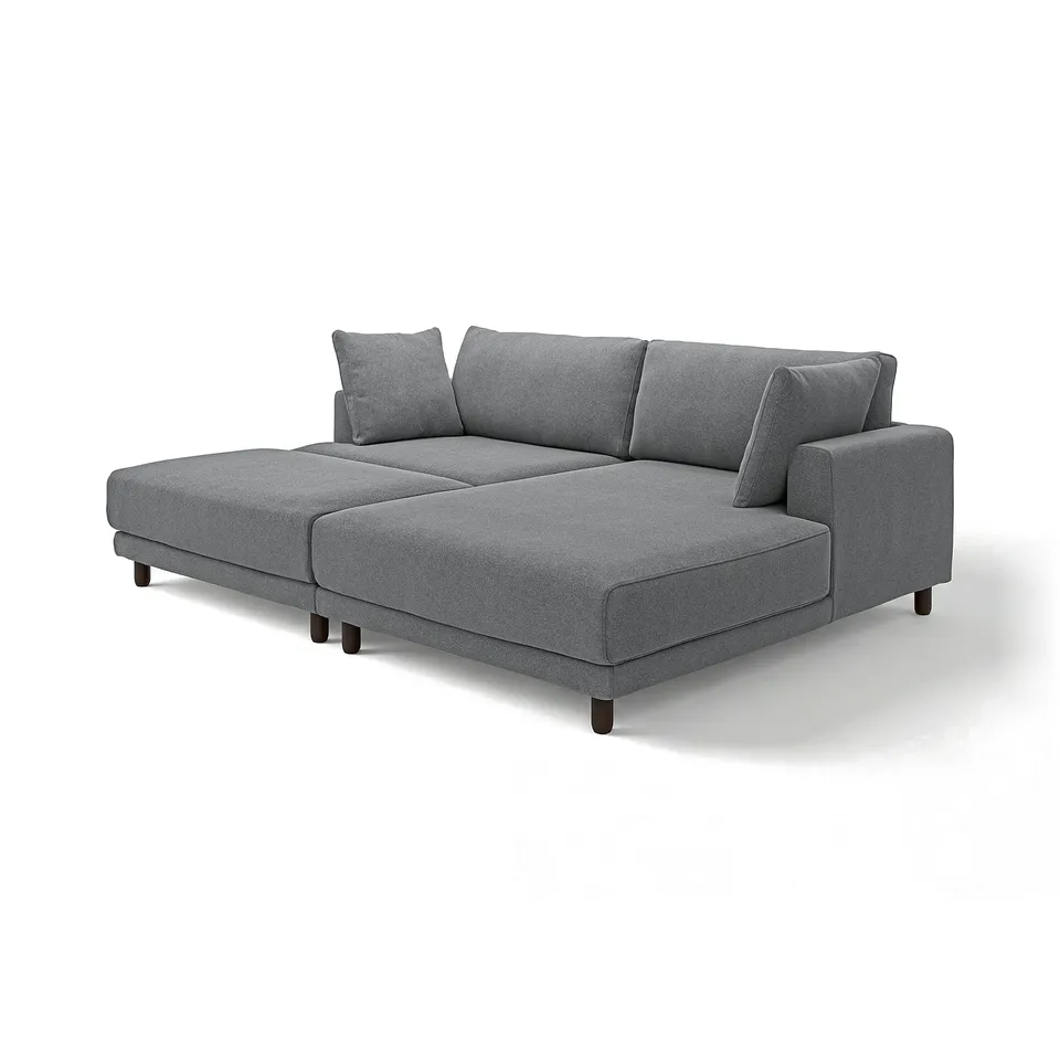 Modern grey l-shaped sectional sofa with wooden legs, soft cushions, and minimalist design.