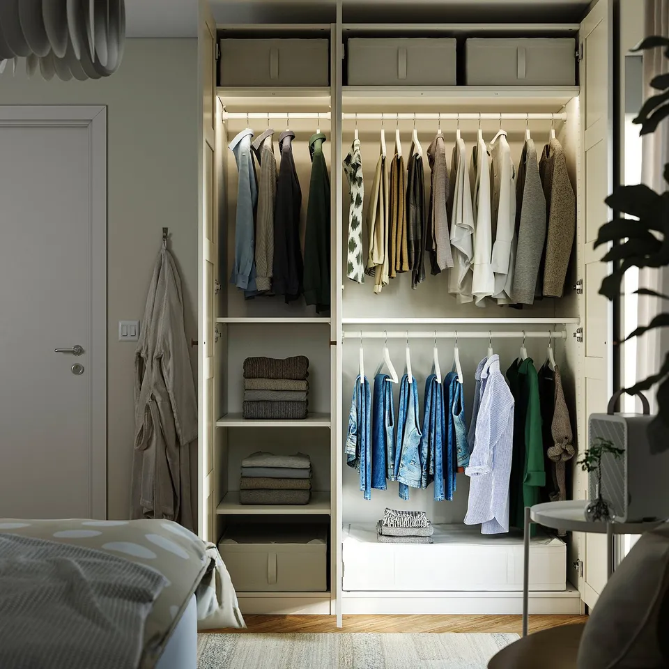 Neat closet with clothes, folded sweaters, and storage bins. The closet has adjustable feet and integrated hinges.