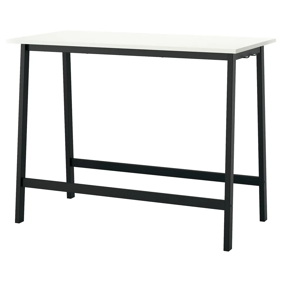 MITTZON desk is sleek, black metal, with white top. Rectangular and modern design.
