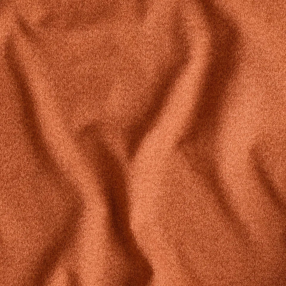 Close-up of texture of burnt orange fabric, displaying smooth quality.