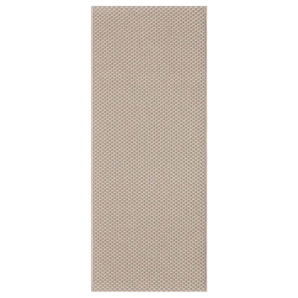 A rectangular MORUM rug, neutral-toned, made of polypropylene, with a woven design.