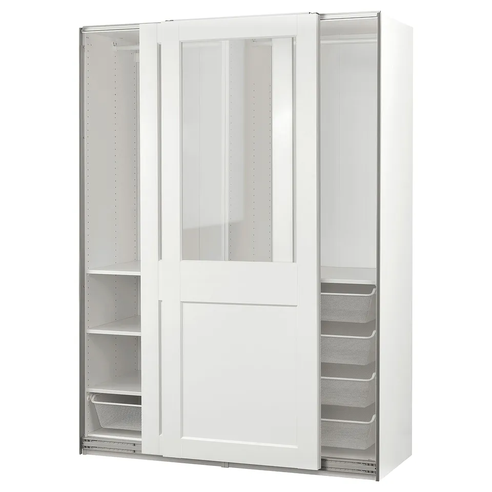 A white PAX wardrobe with glass doors, displaying shelves and drawers inside.