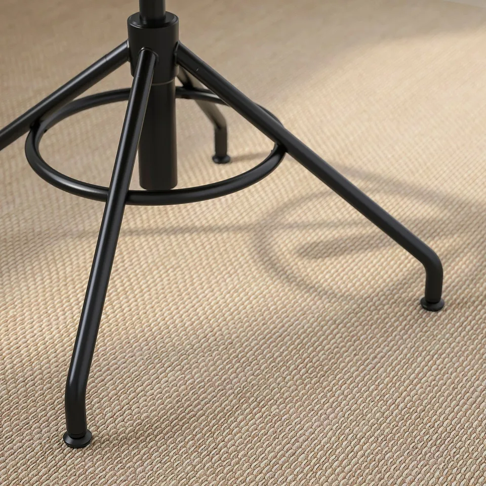 Black metal base, glossy finish, three legs with circular support, sturdy and modern.