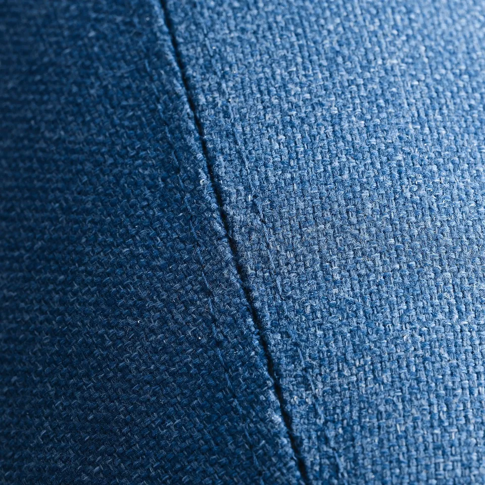 A close-up of soft, blue, woven fabric showcasing its texture and quality.
