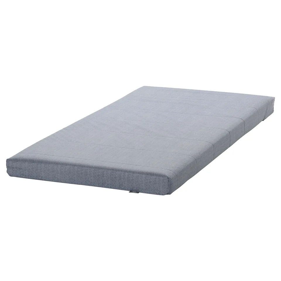 A grey VIHALS daybed mattress with a rectangular shape and a soft, removable cover.