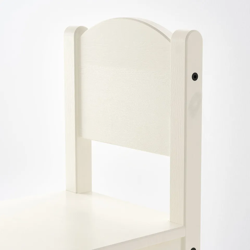 Small white wooden chair with smooth finish and curved backrest. Ideal for kids activities.