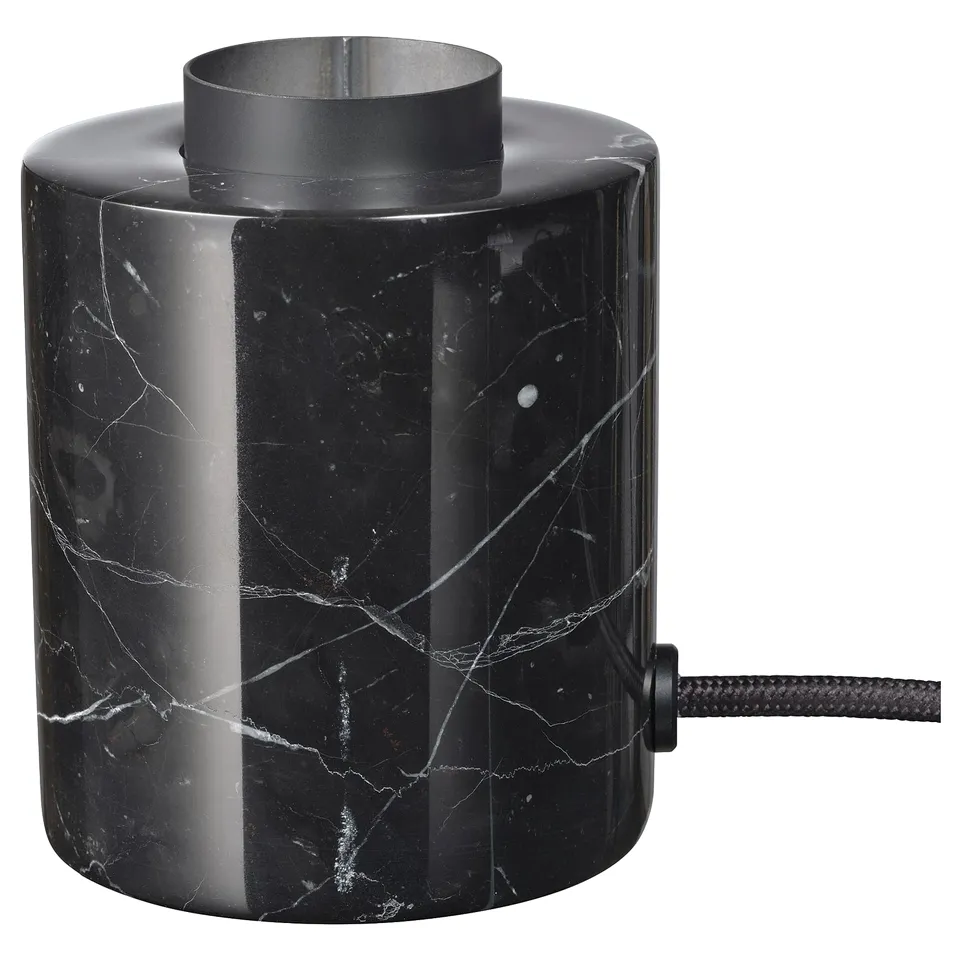 Black marble lamp with sleek, heavy base and metal ring top.